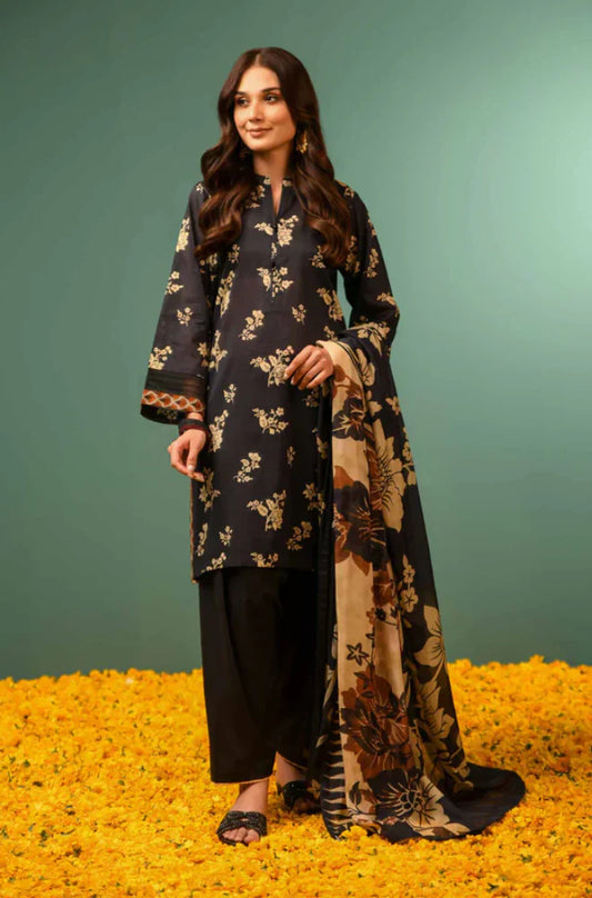 Woman wearing a floral kurta with palazzo pants and dupatta on a green and yellow background