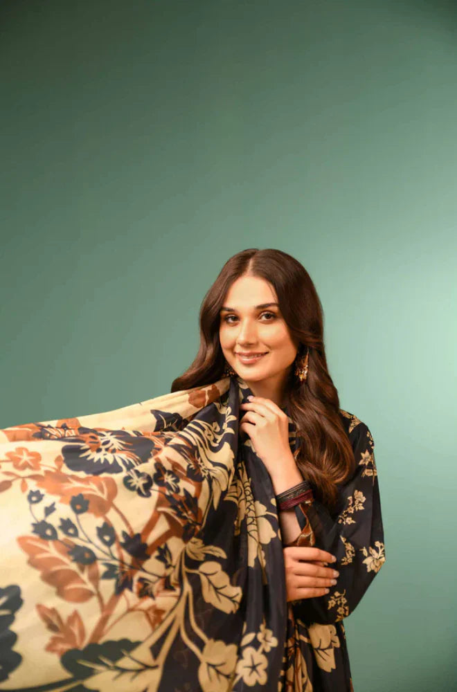 Woman holding a floral-patterned scarf against a green background