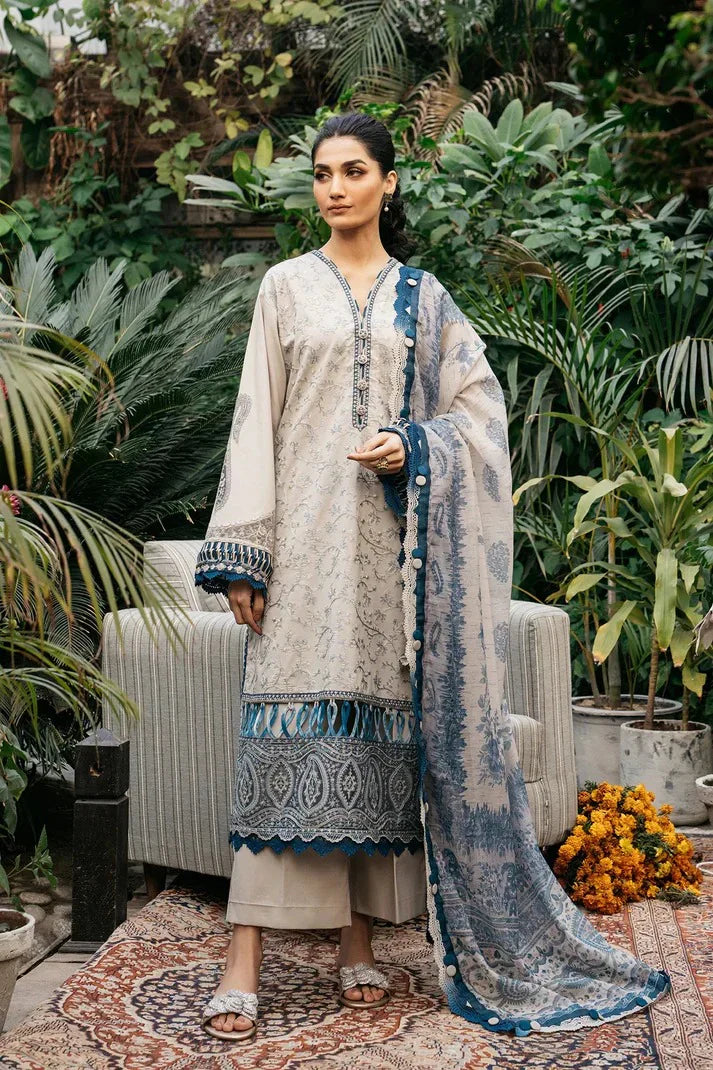 Woman in traditional outfit with a blue and white dupatta in a garden setting