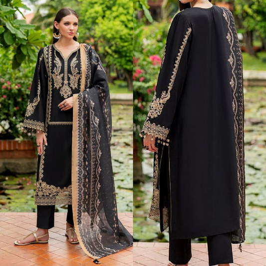Black embroidered outfit with a matching dupatta in an outdoor setting